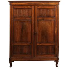 Early 19th Century Italian Walnut Armoire with Carvel Panel Doors & Cabriole Leg