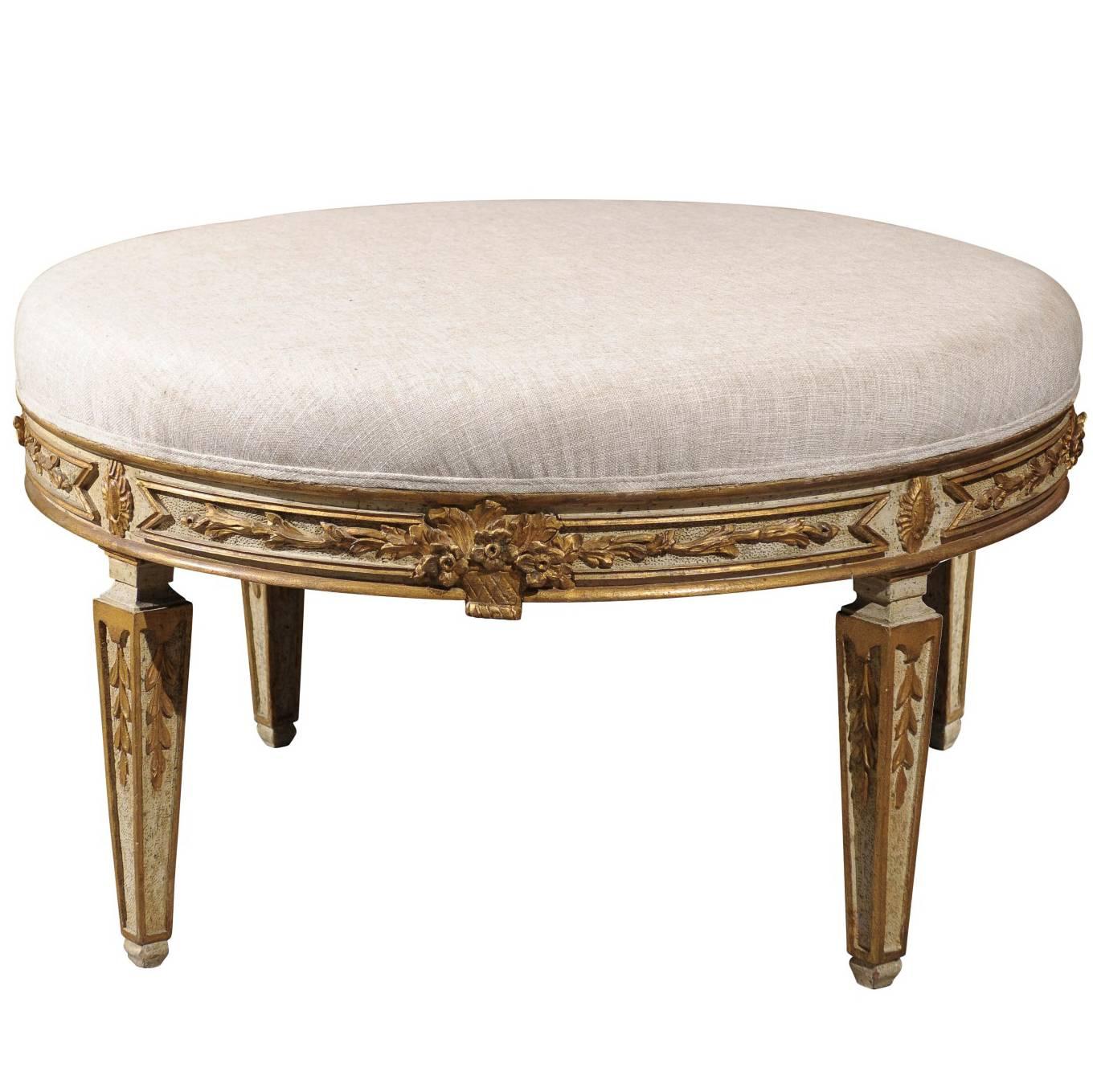 Italian Neoclassical Style Upholstered Round Ottoman with Giltwood Motifs
