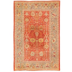  Tapis turc ancien d'Oushak avec motif sur toute sa surface et bordure rouge, gris et orange