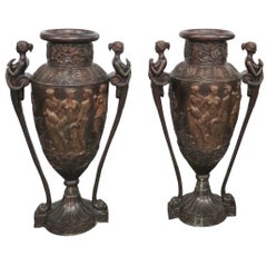 Pair of Figural Bronze Urns with Allegorical Scenes