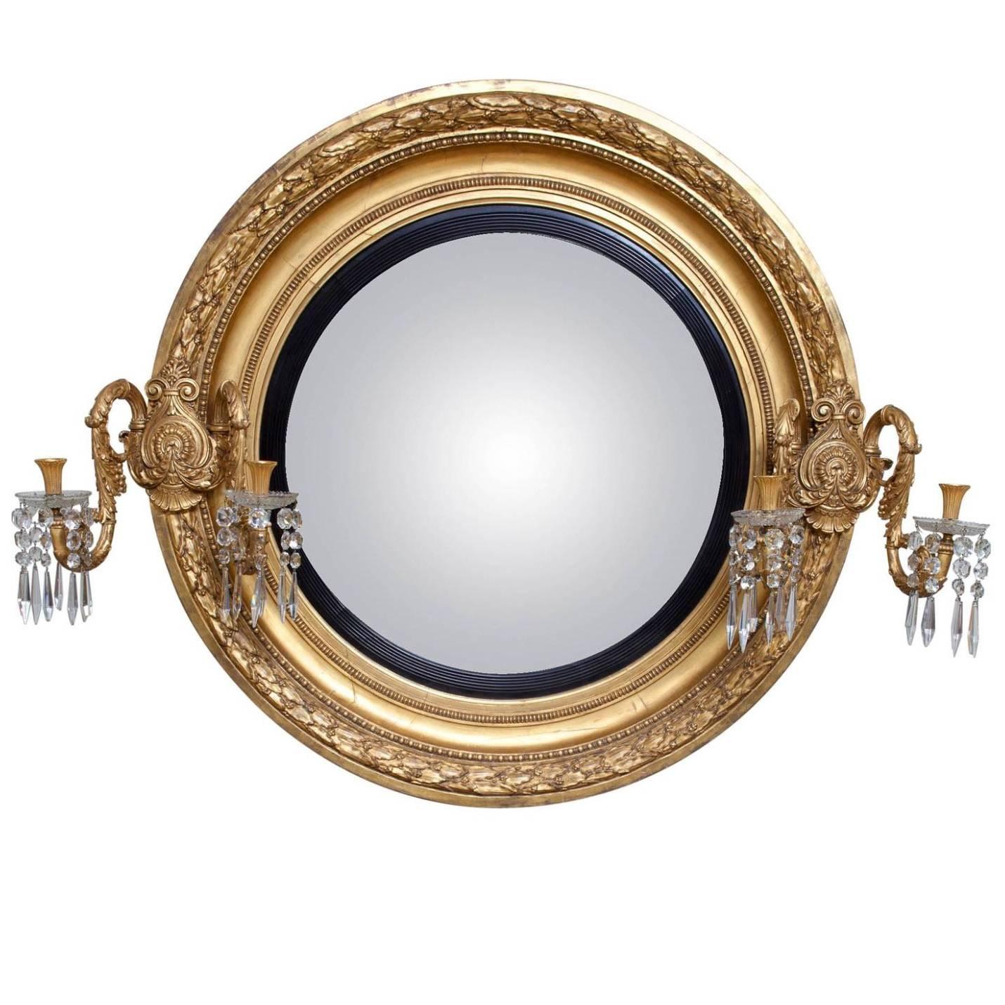 Miroir monumental en bois doré convexe de style Régence du début du 19ème siècle en vente
