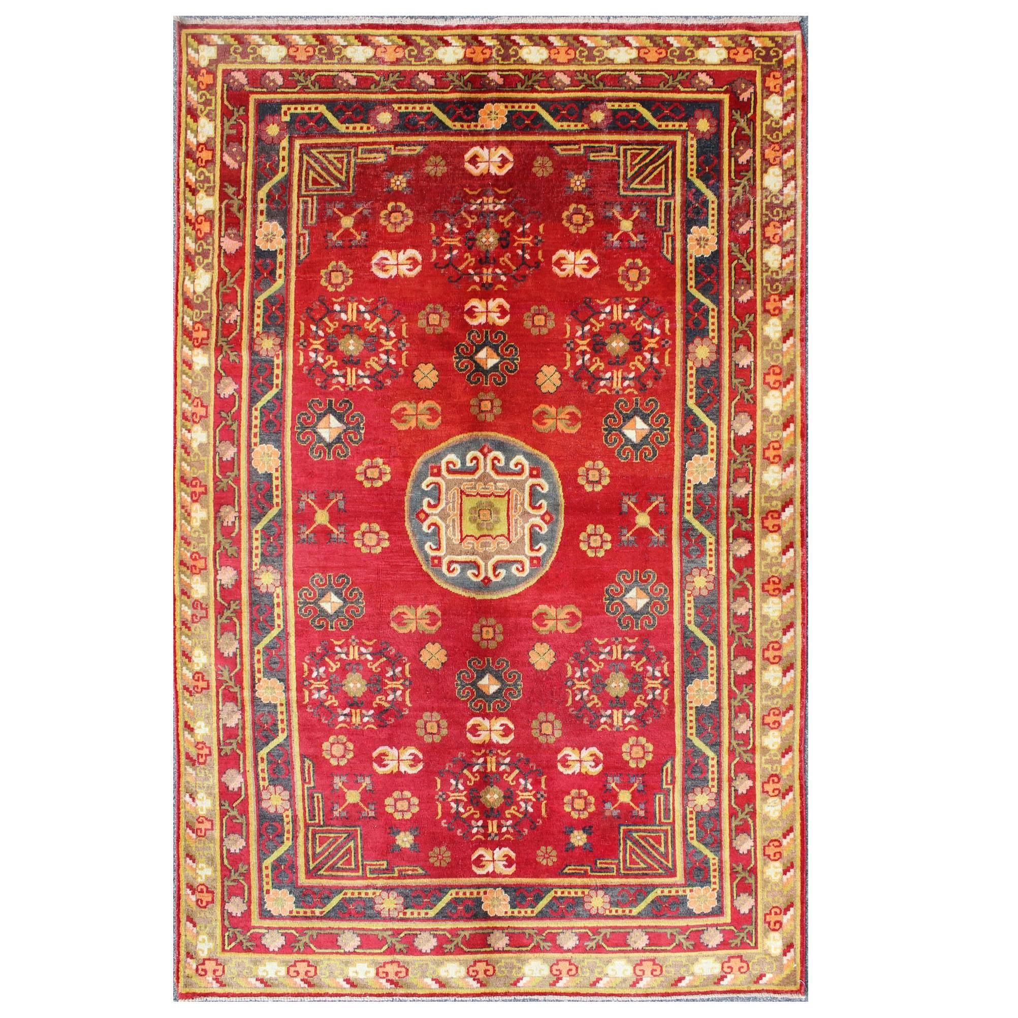 Antique Khotan Rug in Rich Red, Green and Charcoal Colors For Sale