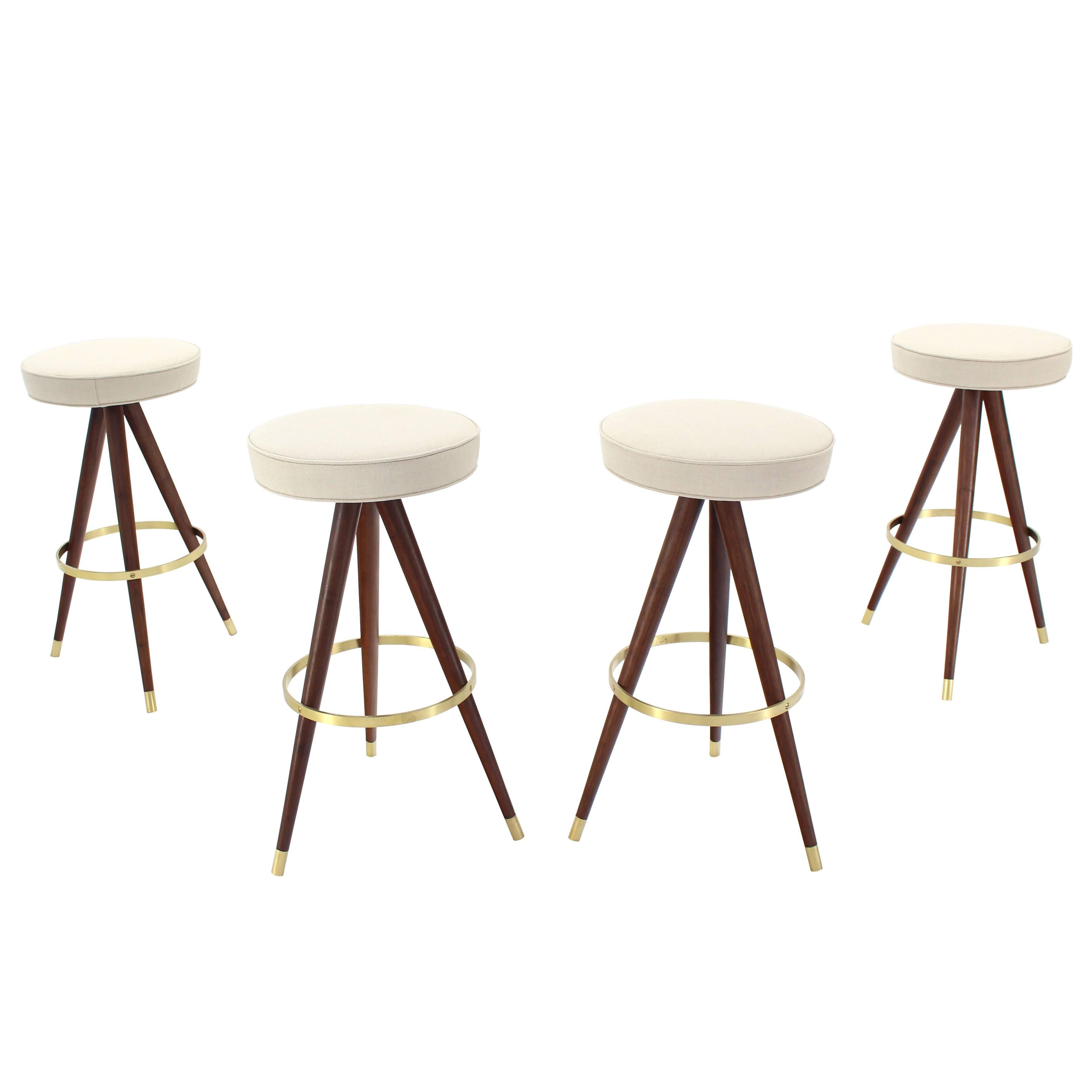 Set of Four Mid-Century Oiled Walnut and Solid Brass Tri-Leg Bar Stools