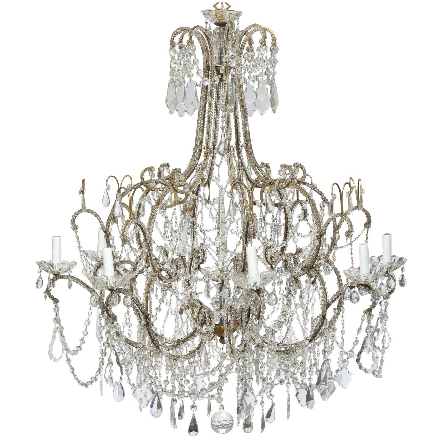 Large Italian 1920s Crystal Gilt Metal Eight-Light Chandelier with Scrolled Arms For Sale