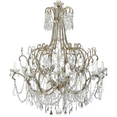 Large Italian 1920s Crystal Gilt Metal Eight-Light Chandelier with Scrolled Arms