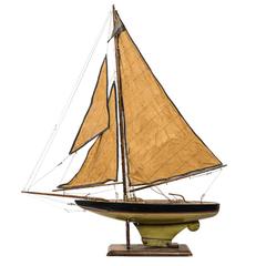 Antique Pond Boat with Amber Sails