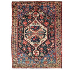 Colorful Antique Persian Bakhtiari Rug in Navy Background, Blue, Yellow, Red Colorful Antique Persian Bakhtiari Rug in Navy Background, Blue, Yellow, Red
