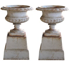 Handsome American Neoclassical Style Iron Painted Campagna Urns on Stands, pair
