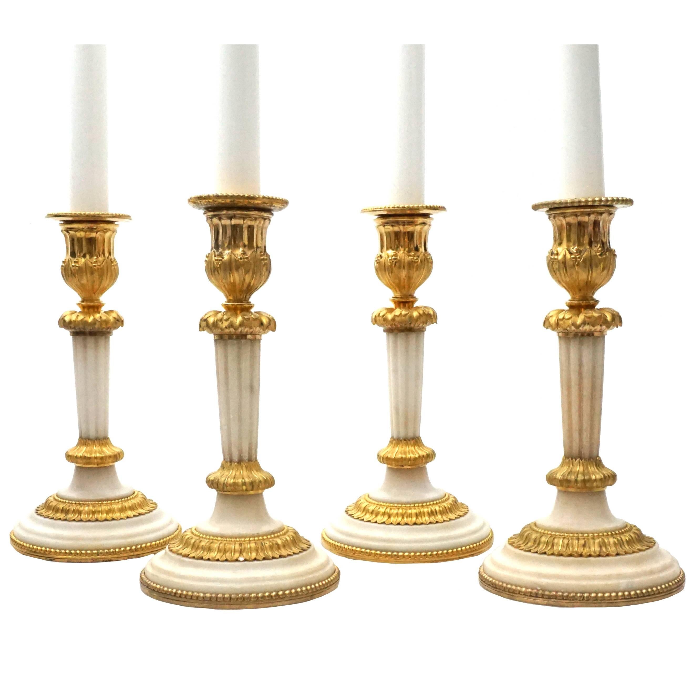 Rare Set of Four Empire Marble and Gilt Bronze Candlesticks, France, circa 1810 For Sale