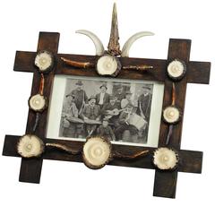 Cabin Style Frame with Antler Decoration and Antique Print