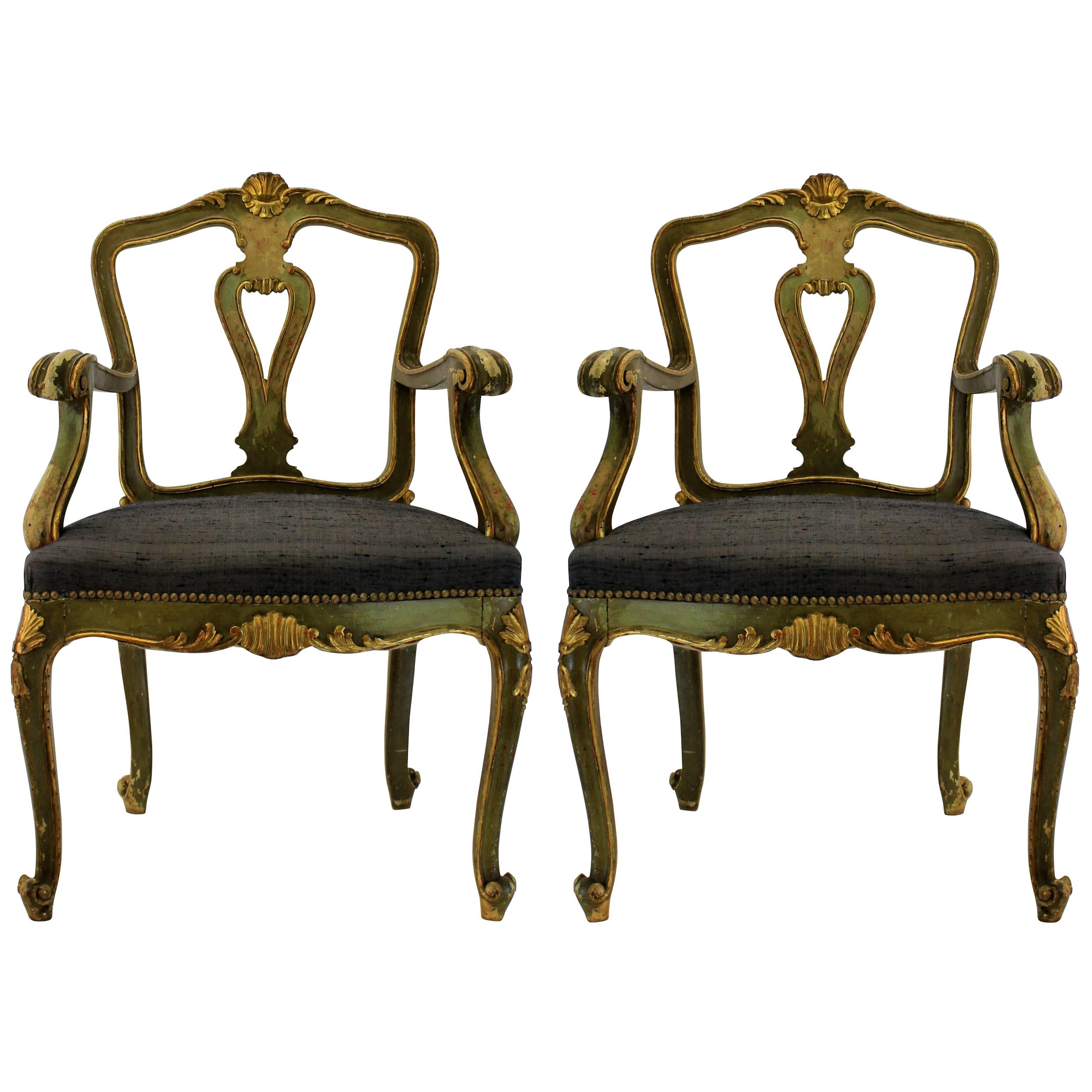 A pair of Northern Italian painted and water gilded armchairs with attractive backs. Newly upholstered in charcoal grey dupion silk.
  