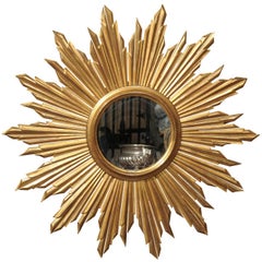 French Mid 20th Century Giltwood Sunburst Mirror with Rays of Varying Sizes