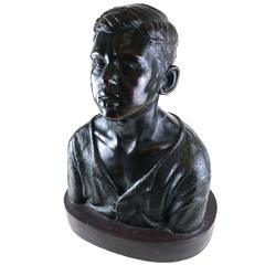 Life Sized Cast Bronze Bust of Expressive Young Boy on Oval Base