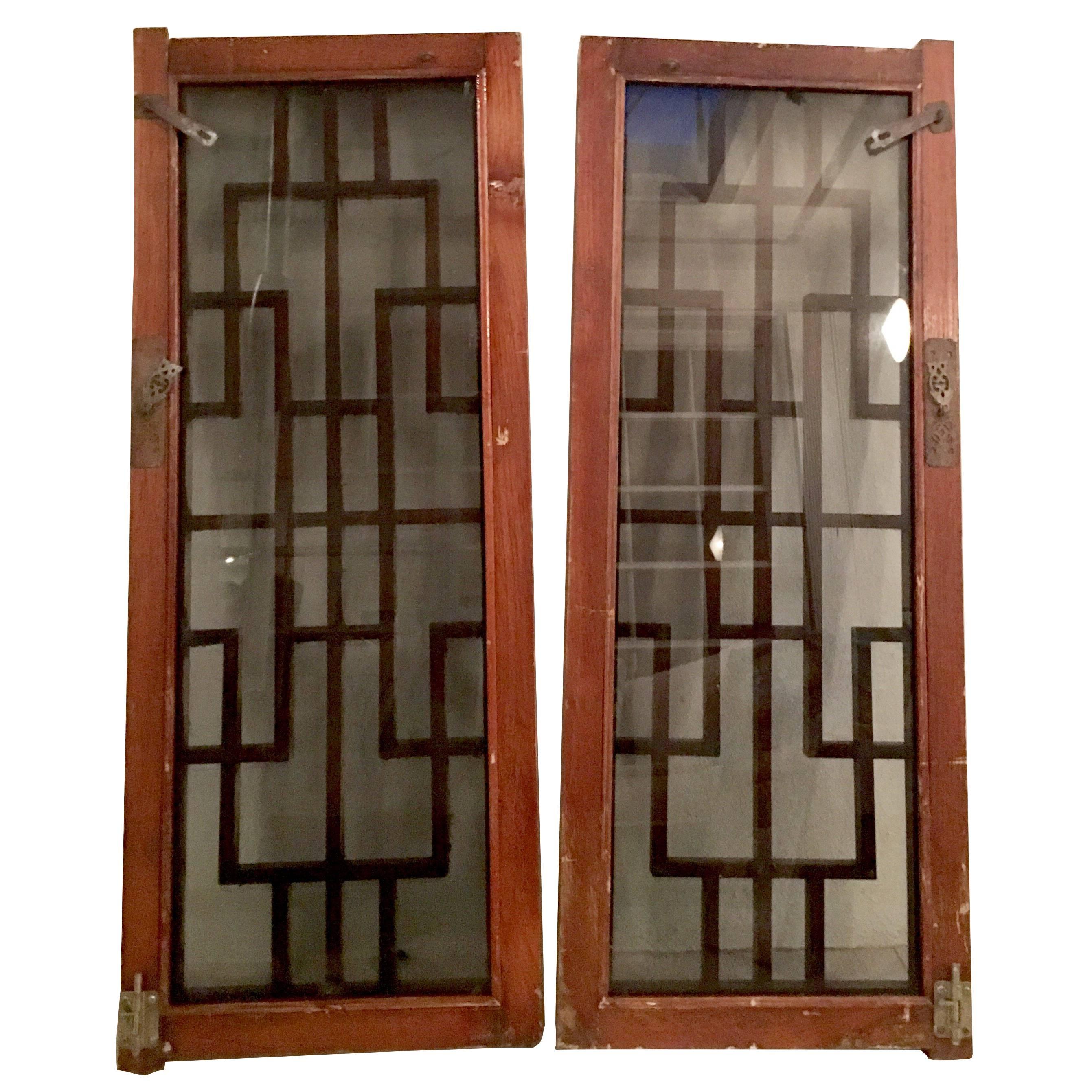 Antique Pair Of Chinese Geometric Carved Mahogany & Smoke Glass Windows For Sale