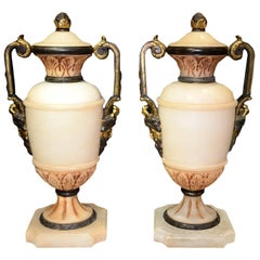 Neoclassical Pair of Carved Alabaster and Bronze Urns with Mask Face Handles