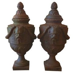 Pair of 19th Century Cast Iron Lidded Urns with Swags and Satyr Mask