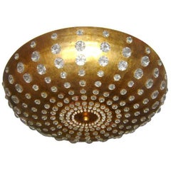 Lámpara de metal dorado y cristal insertado