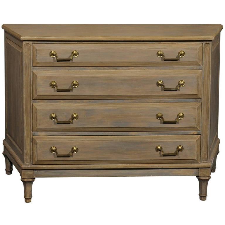 Painted Wood FourDrawer Chest with Neutral Beige Color and Narrowing