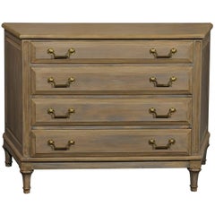 Painted Wood Four-Drawer Chest with Neutral Beige Color and Narrowing Front