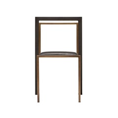 Silla de comedor de cuero negro y acero ennegrecido