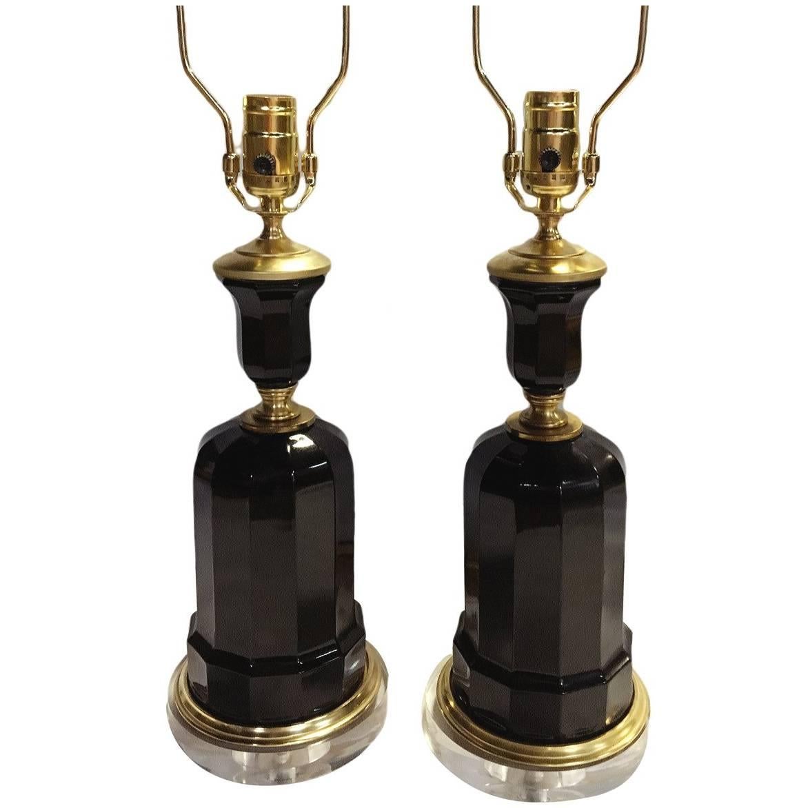 Pair of 1950’s French black glass table lamps with gilt details and lucite bases.

Measurements:
Height of body: 14″
Height to shade rest: 22″
Diameter: 6