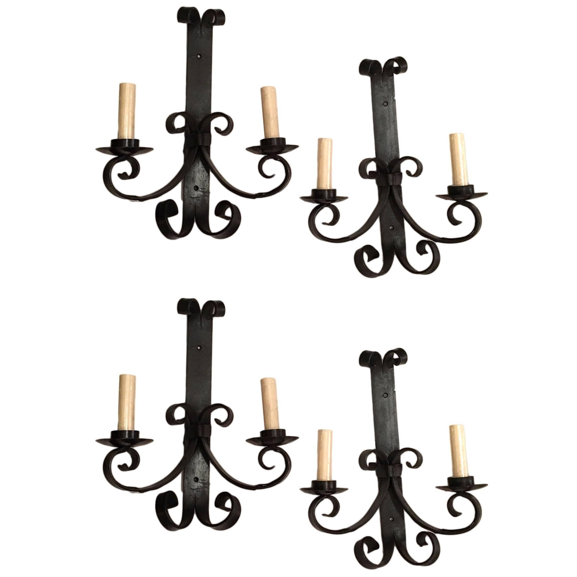 Set of four circa 1950's Italian wrought iron sconces. Sold per pair.

Measurements:
Height: 14.5