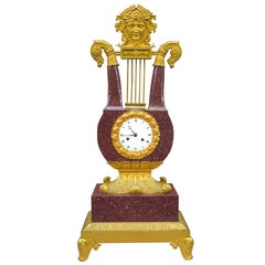 Très belle horloge lyre impériale Charles X en porphyre