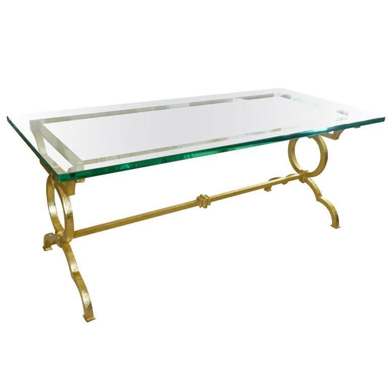 This elegant, timeless and moderne vintage cocktail table has a French twist. It is rich in finish and rich in look. This table rings regality with a classical and modern look. It has the style of Tommi Parzinger meets French 1940s in the manner of