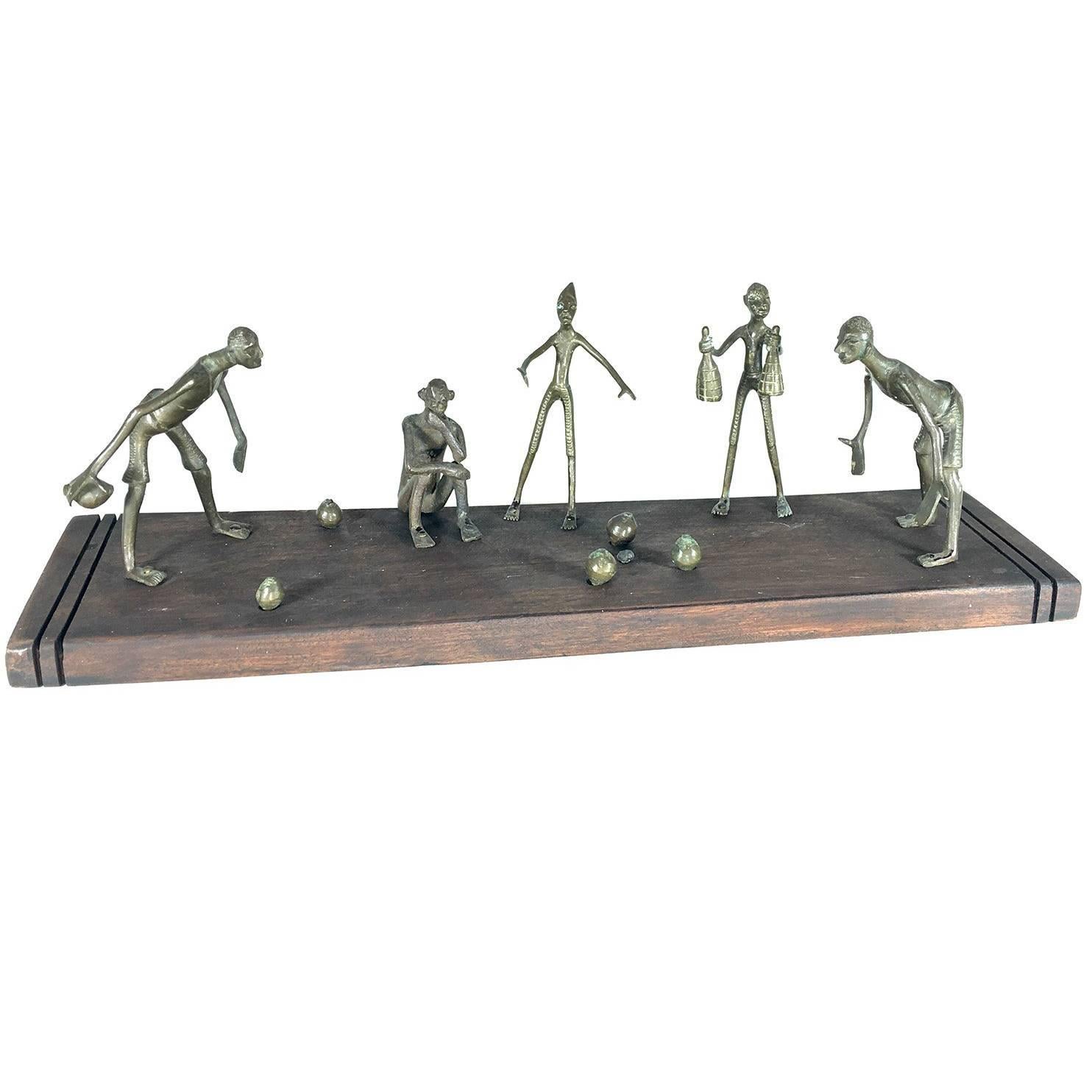 African Bronze Sculpture, with Characters Playing a Game For Sale
