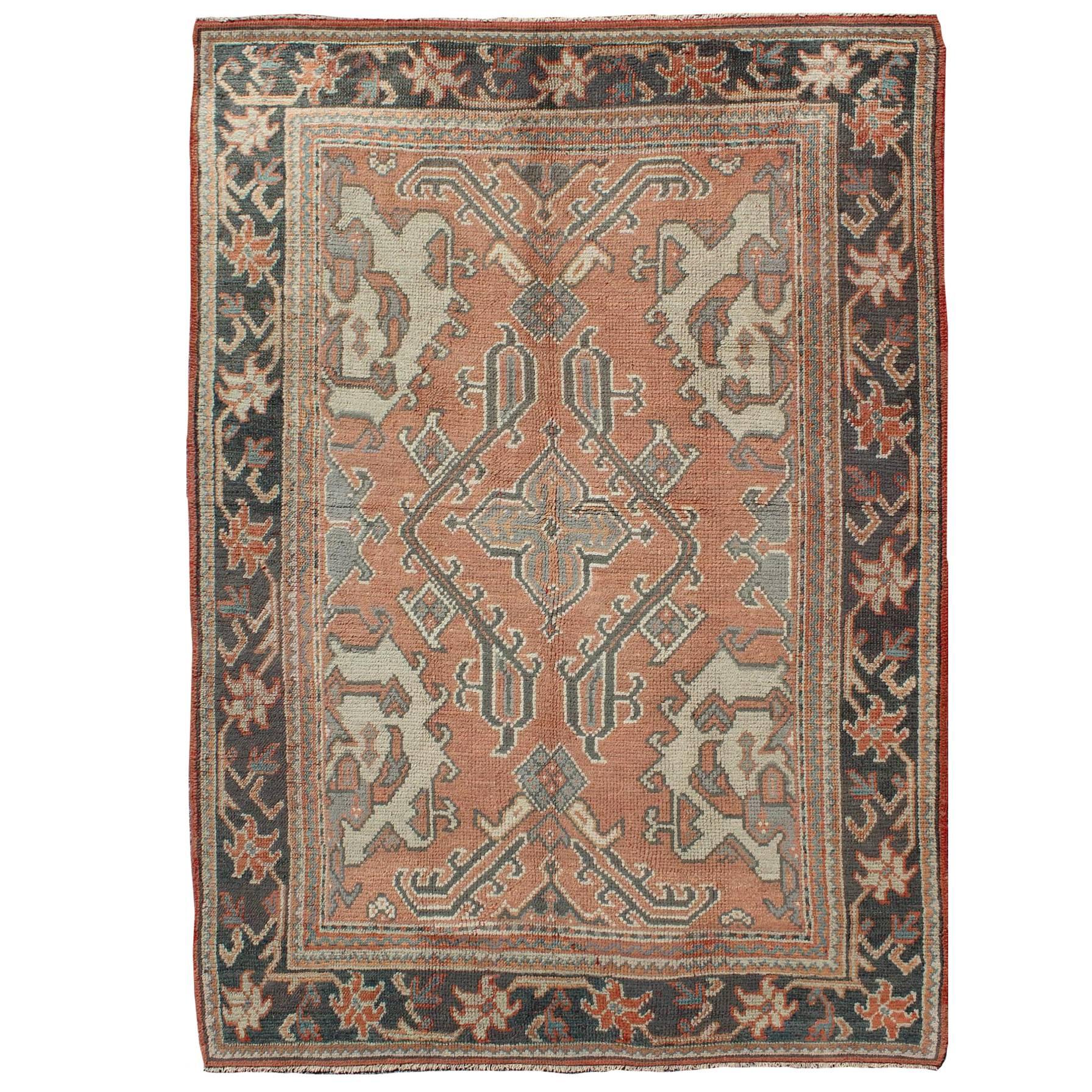 Antique Oushak Rug from Turkey with Central Medallion and Sub-Geometric Elements