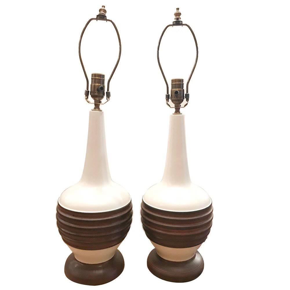 Pair of circa 1960's Italian two-tone ceramic table lamps.

Measurements:
Height of body: 16.75