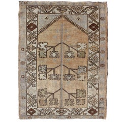 Antique Oushak Carpet from Turkey with Geometric Tribal Shapes in Brown and Tan