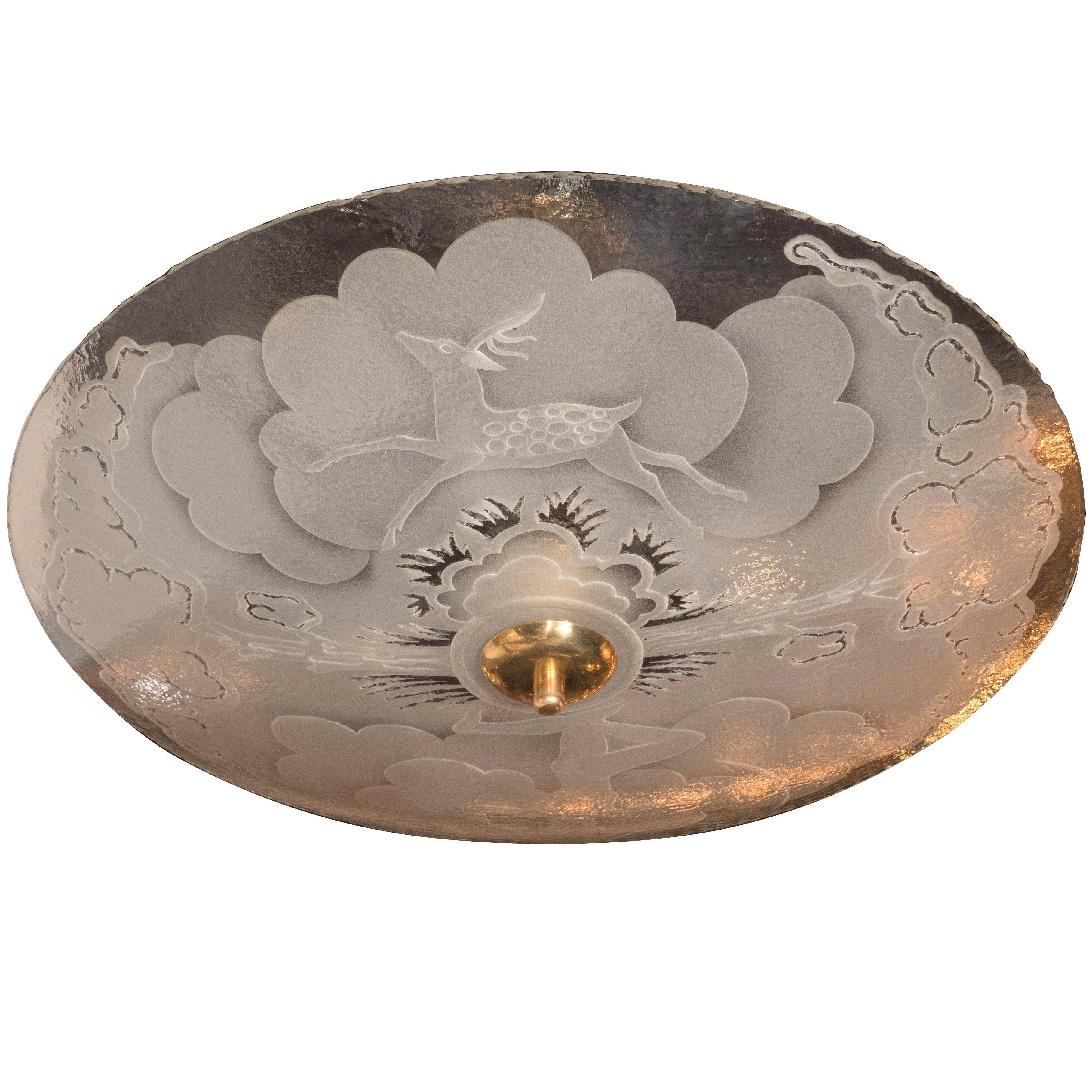 This stunning frosted glass ceiling mount depicts a classical hunting scene. A nude male figure appears poised with a bow, moments after releasing an arrow. On the opposite side, a young spotted buck prances. Stylized Art Deco Cloud and foliage