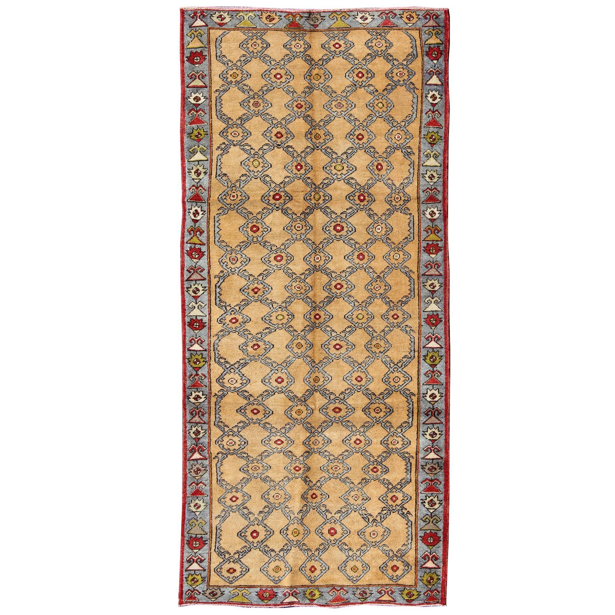 Colorful Turkish Oushak Runner with Striking Yellow Field and Geometric Motifs For Sale
