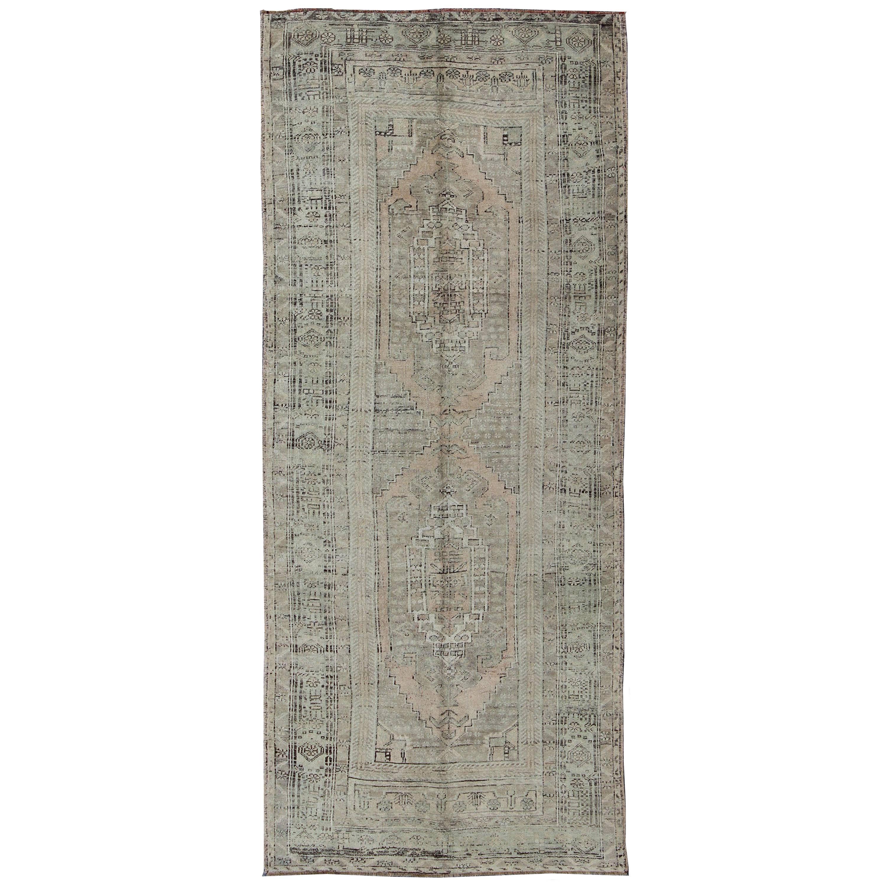 Muted Vintage Turkish Oushak Carpet with Dual-Medallion Design  For Sale