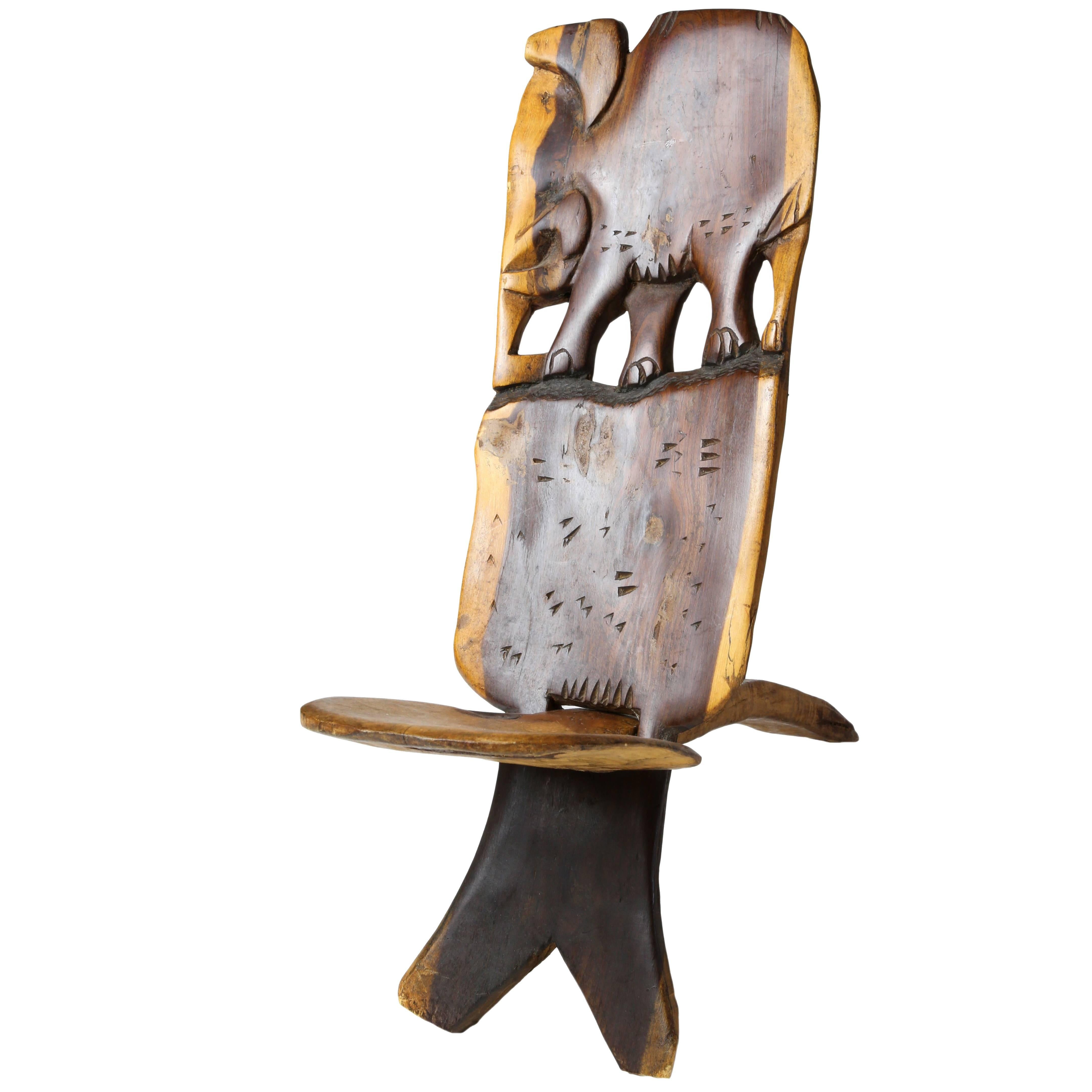 African Two-Piece Small Carved Paddle Chair with Elephant Carving For Sale