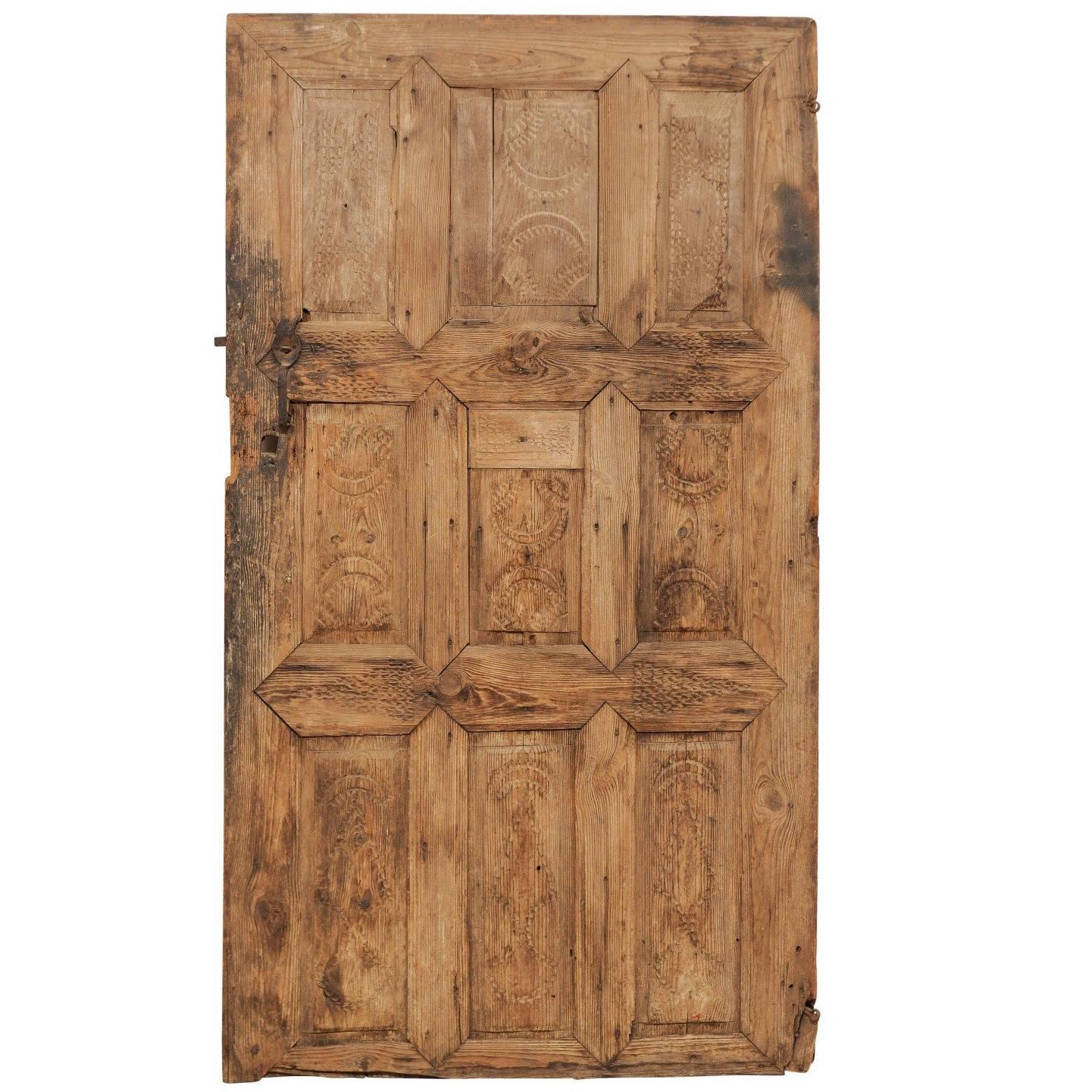 Single 19th Century European Rustic Wood Door with Delicate Carved Pattern