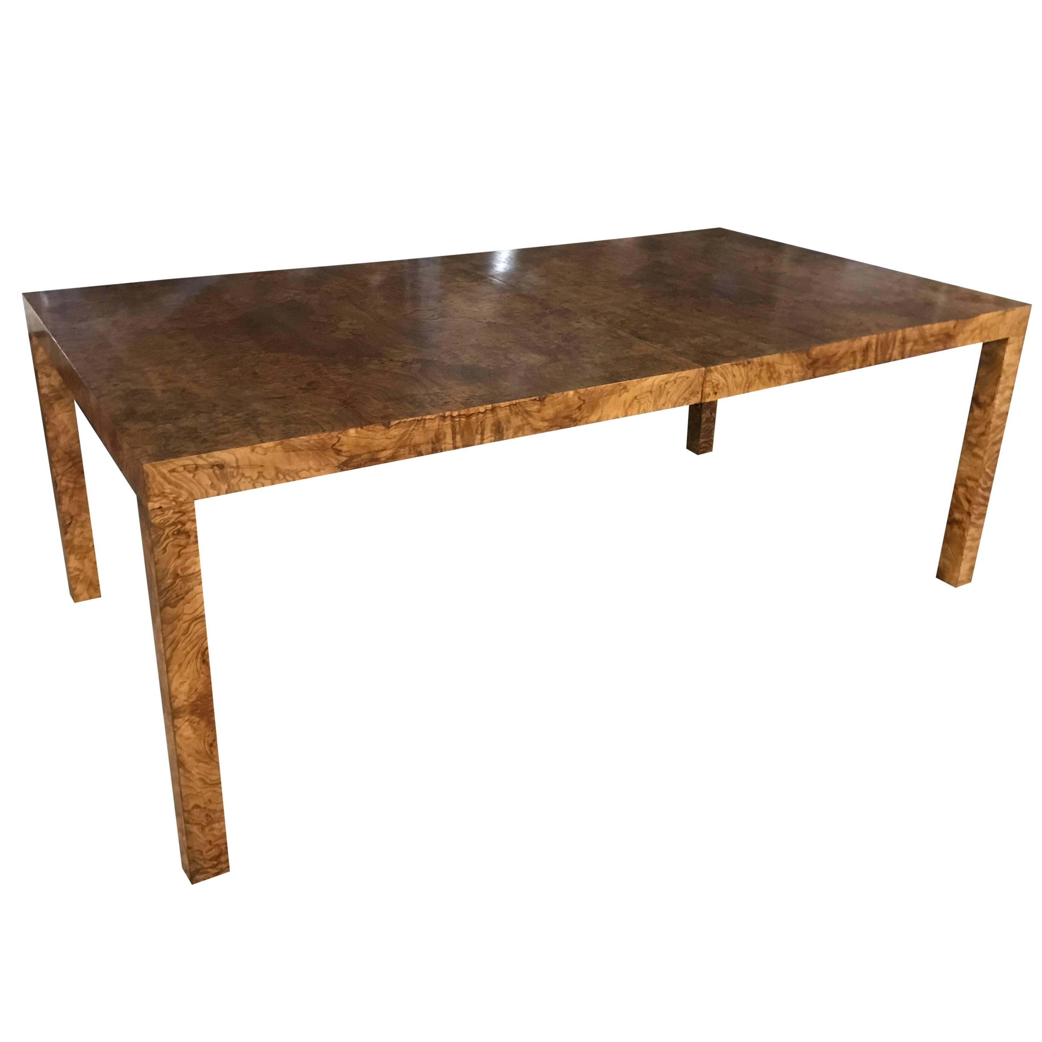 Large Milo Baughman for Directional burl wood Parsons dining table with two boards.
Hard to find, expertly finished Mid-Century Modern dining room table. Beautiful deep, rich variegated cinnamon coffee burl standing on four fully finished square