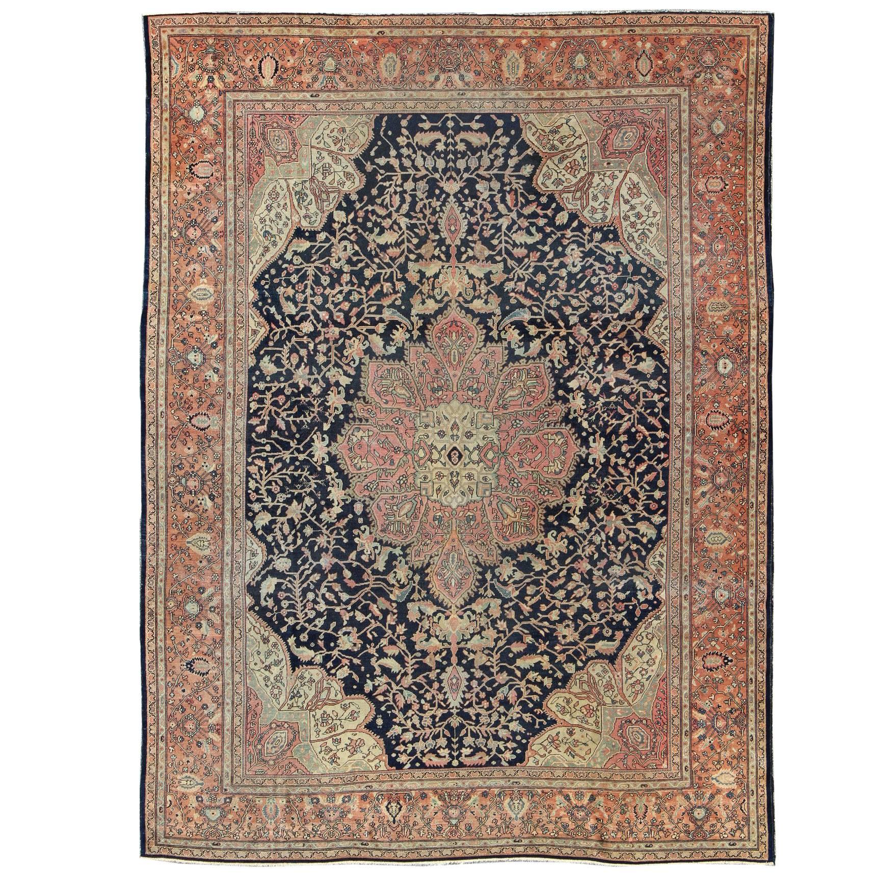 Antique Sarouk Farahan with Floral Motifs in Salmon, Green, Beige and Navy Blue For Sale