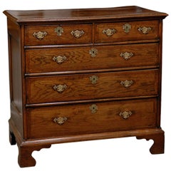 English 1820s Regency Oak Five-Drawer Commode with Crossbanding and Bracket Feet