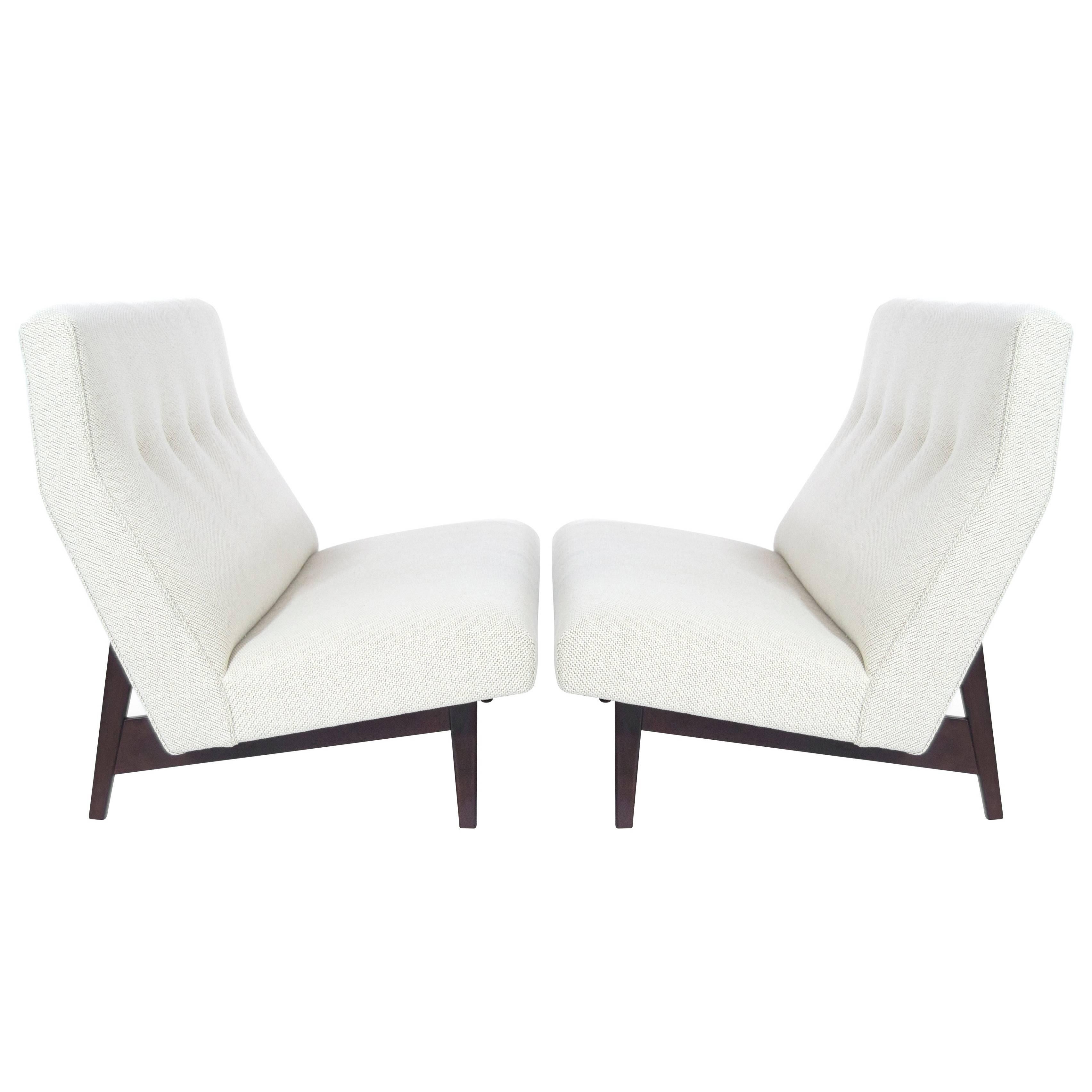 Stunning and rare pair of Jens Risom for Jens Risom designs pair of loveseats, model U-251, circa 1950s. Sculptural walnut bases have been completely restored. Newly upholstered in an off-white Maharam/Kvadrat Coda soft wool.

Priced individually.