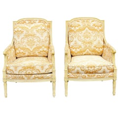 Pair of Distressed Cream Painted Carved Bergeres