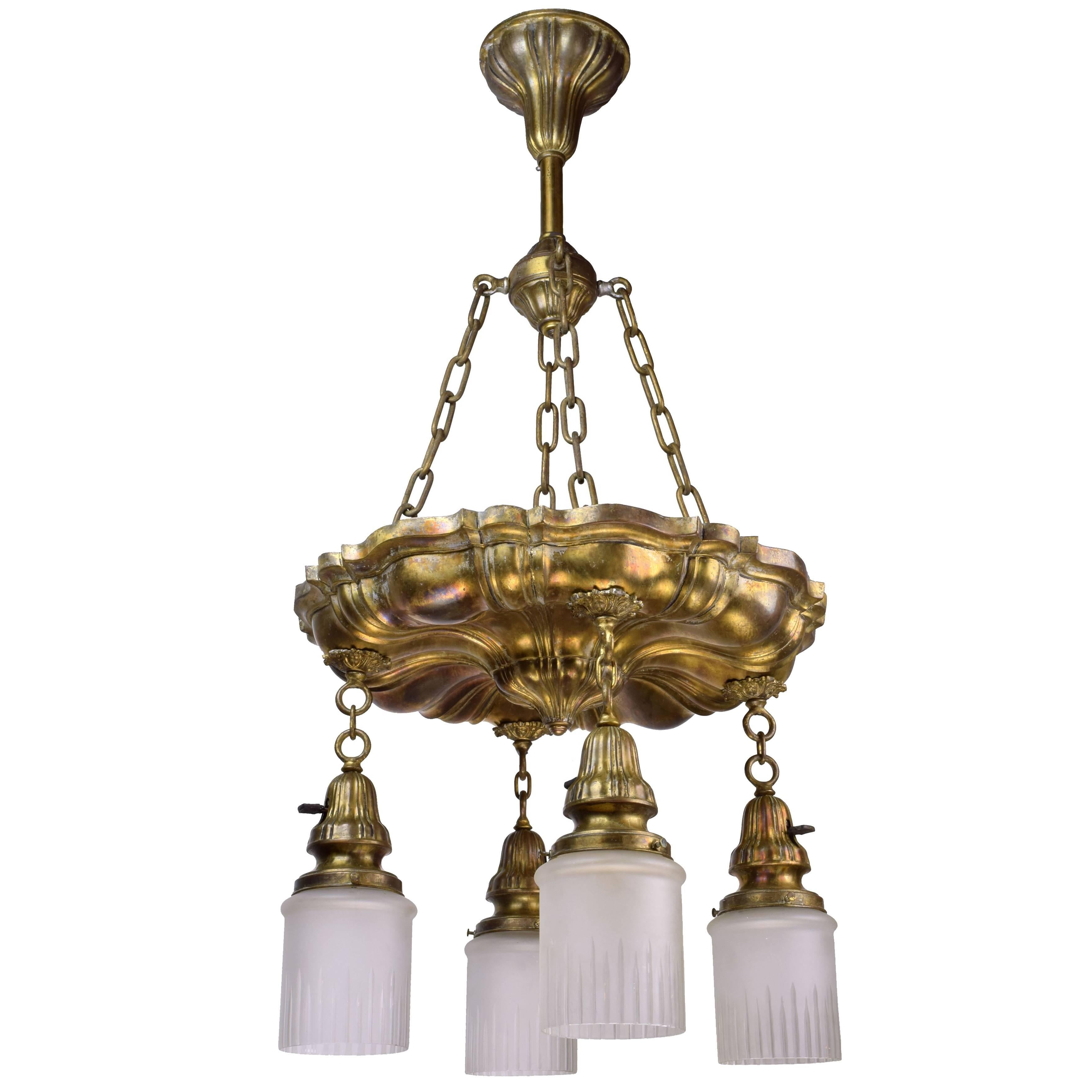 Gorgeous brass pan fixture with the distinctive shell-like ribbing and elegant lines indicative of the Sheffield style. The brass has incredible patina of almost iridescent hues that catch the light in dazzling ways. This fixture comes compete with