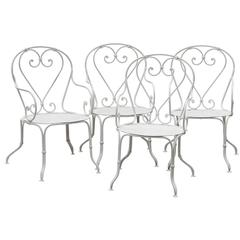 Set of Four French Wrought Iron Garden Armchairs, circa 1900