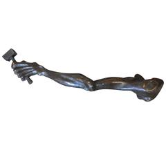 Bronze Sculpture of an Arm and Mallet