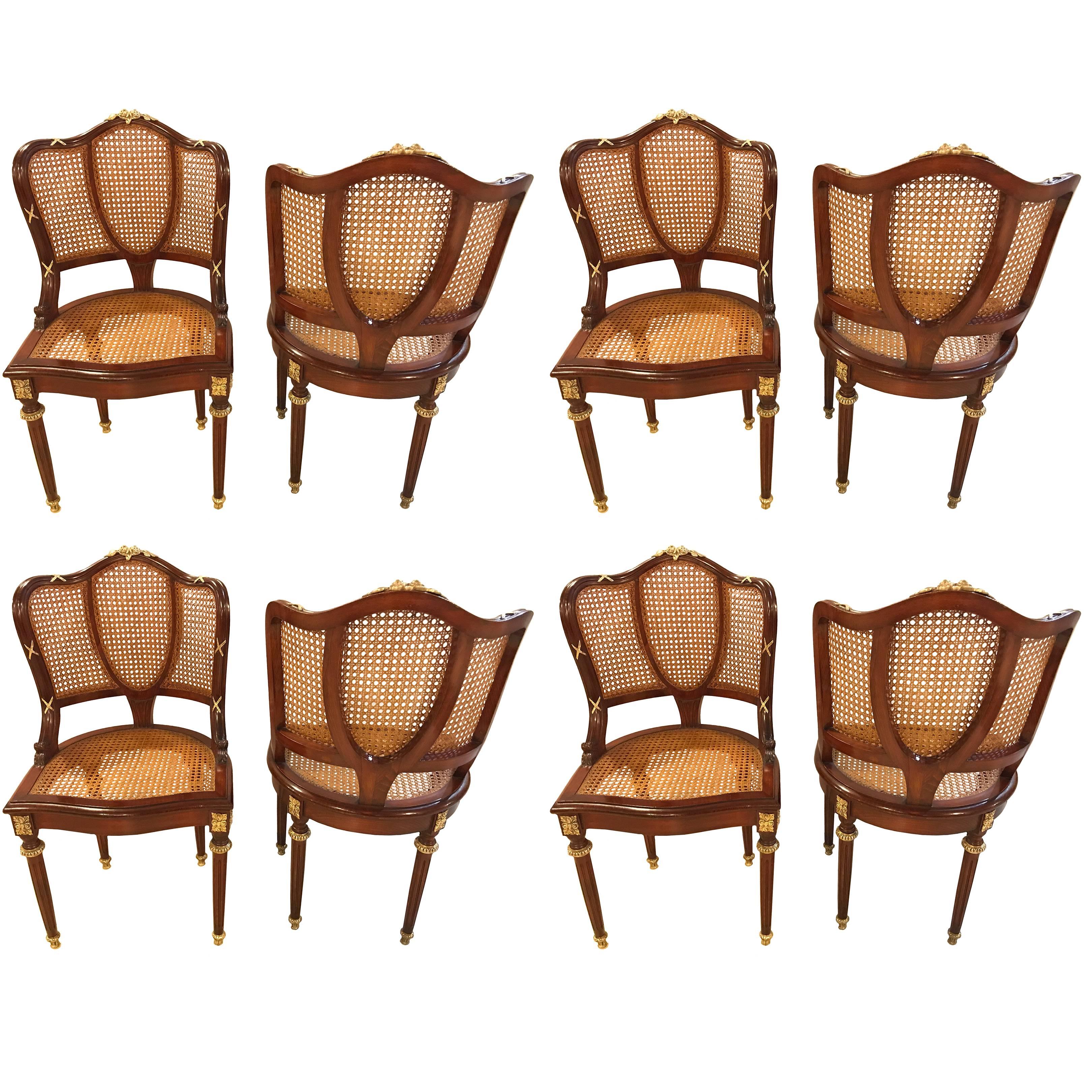 Set of eight fine bronze-mounted Louis XVI style dining chairs. This is a simply magnificent set of Maison Jansen solid mahogany dining chairs each having all-over bronze mounts. The entire set having recently been cleaned and the wood French