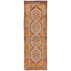 Colorful Antique Oushak Runner with Four Medallions in Yellow, Red, Green, Gray