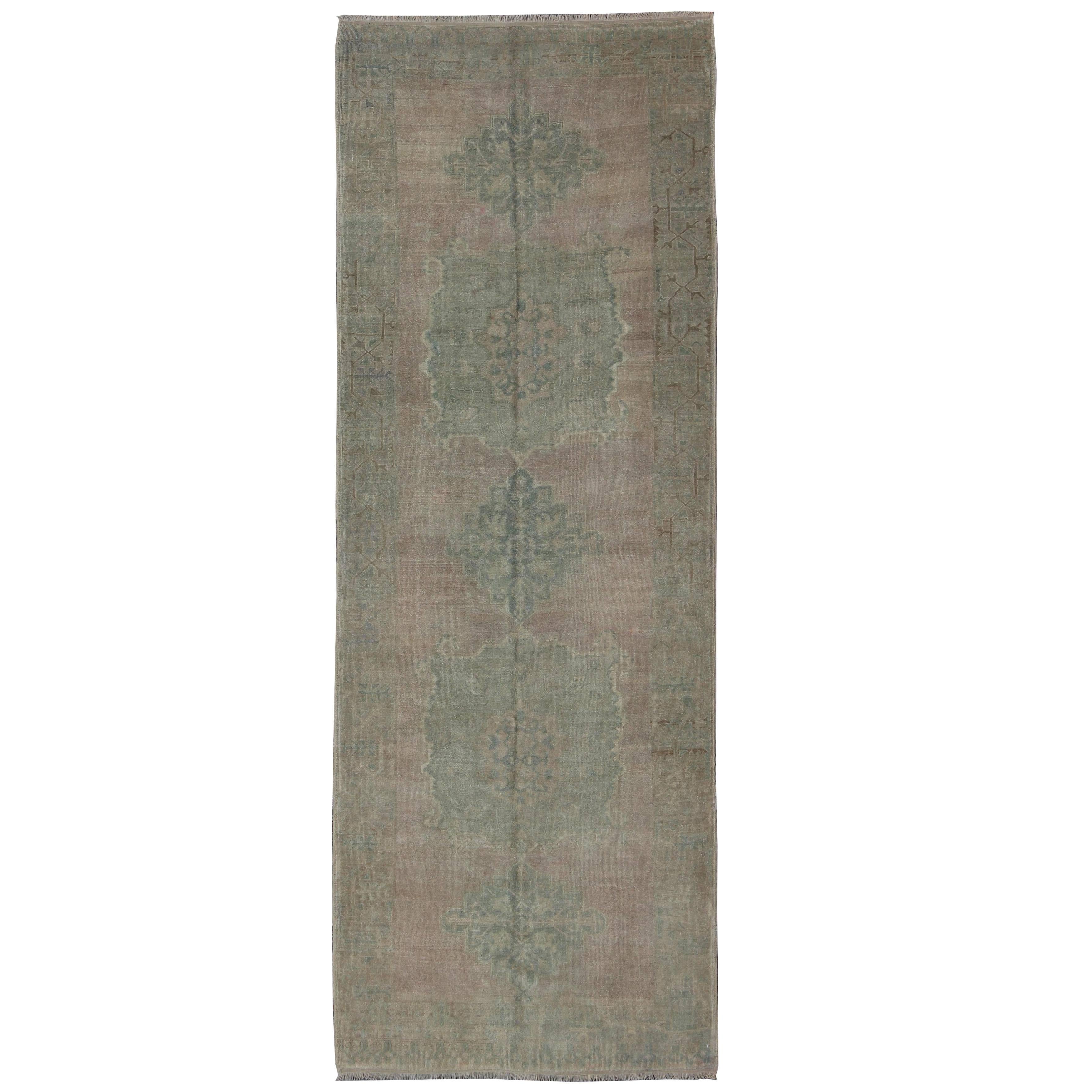 Faded Vintage Turkish Oushak Runner with Dual-Medallion in Lavender and Green For Sale