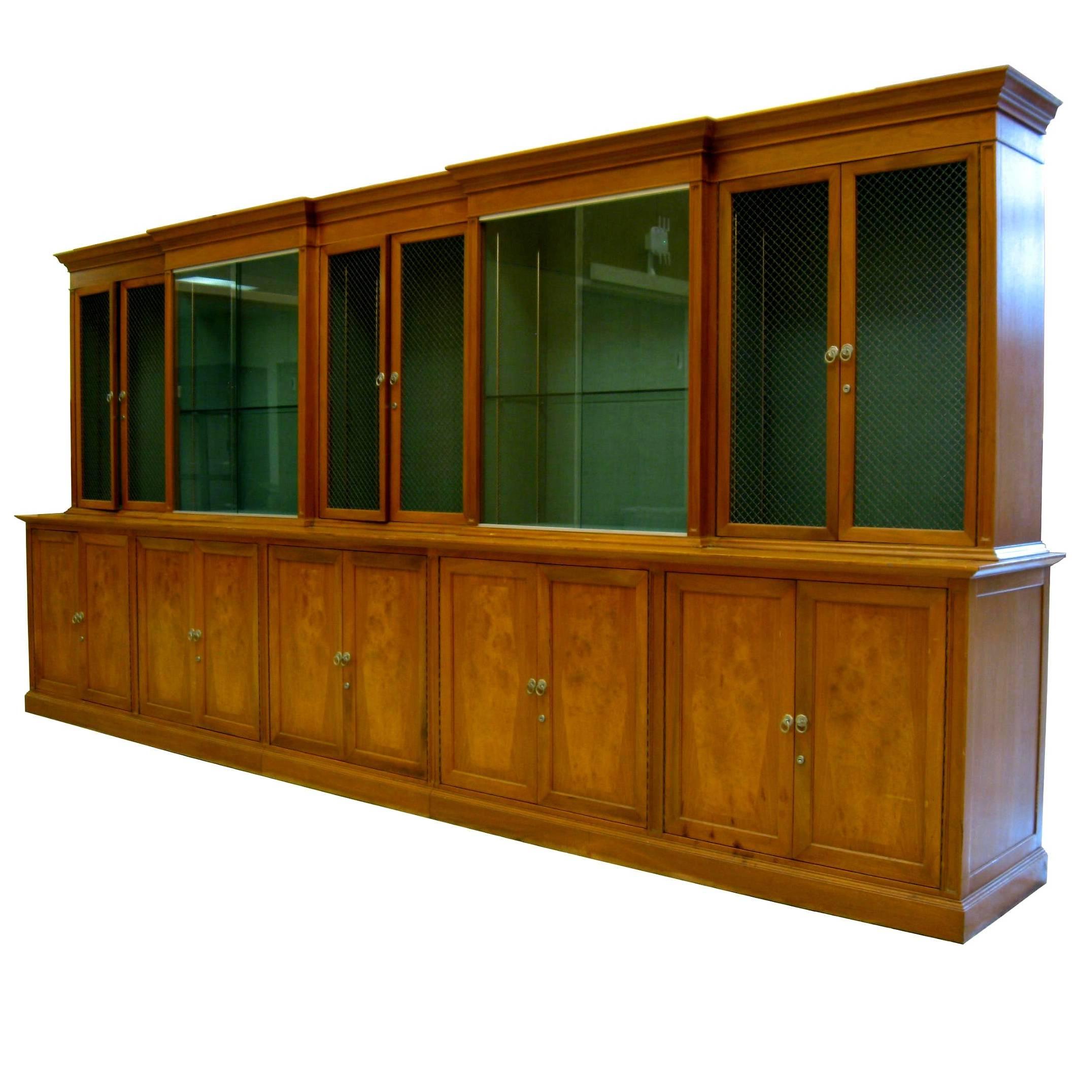 These spectacular Wall units by Romweber feature an interesting mix of Classical and Mid-Century Modern details reminiscent of Harold Schwartz designs. Shown is one of two matching 15 ft long cabinets and both are available for sale (priced per