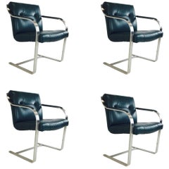 Set of Four Leather and Stainless Cantilever Dining Chairs by Brueton